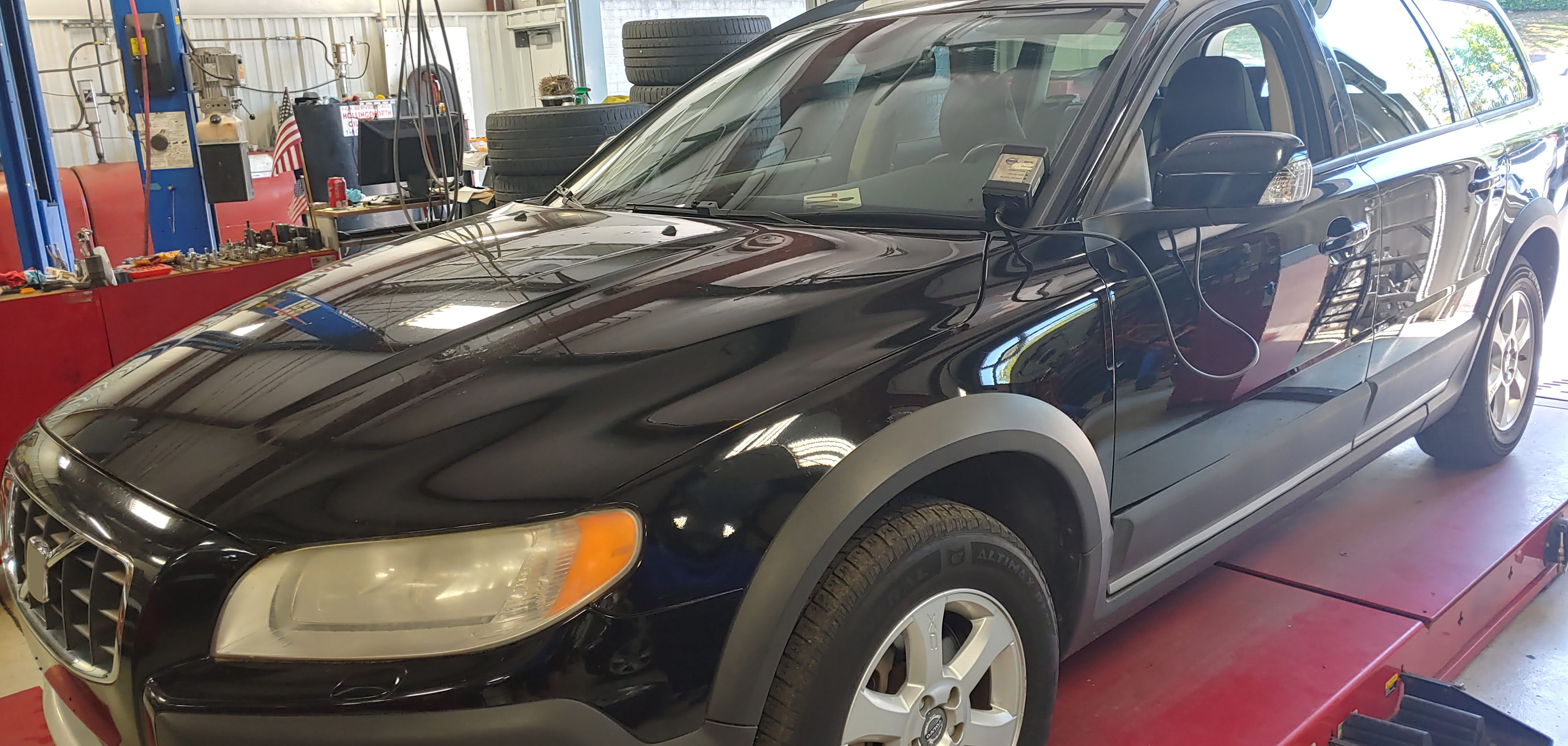 Black Volvo XC70 Inside Our Garage for Repair